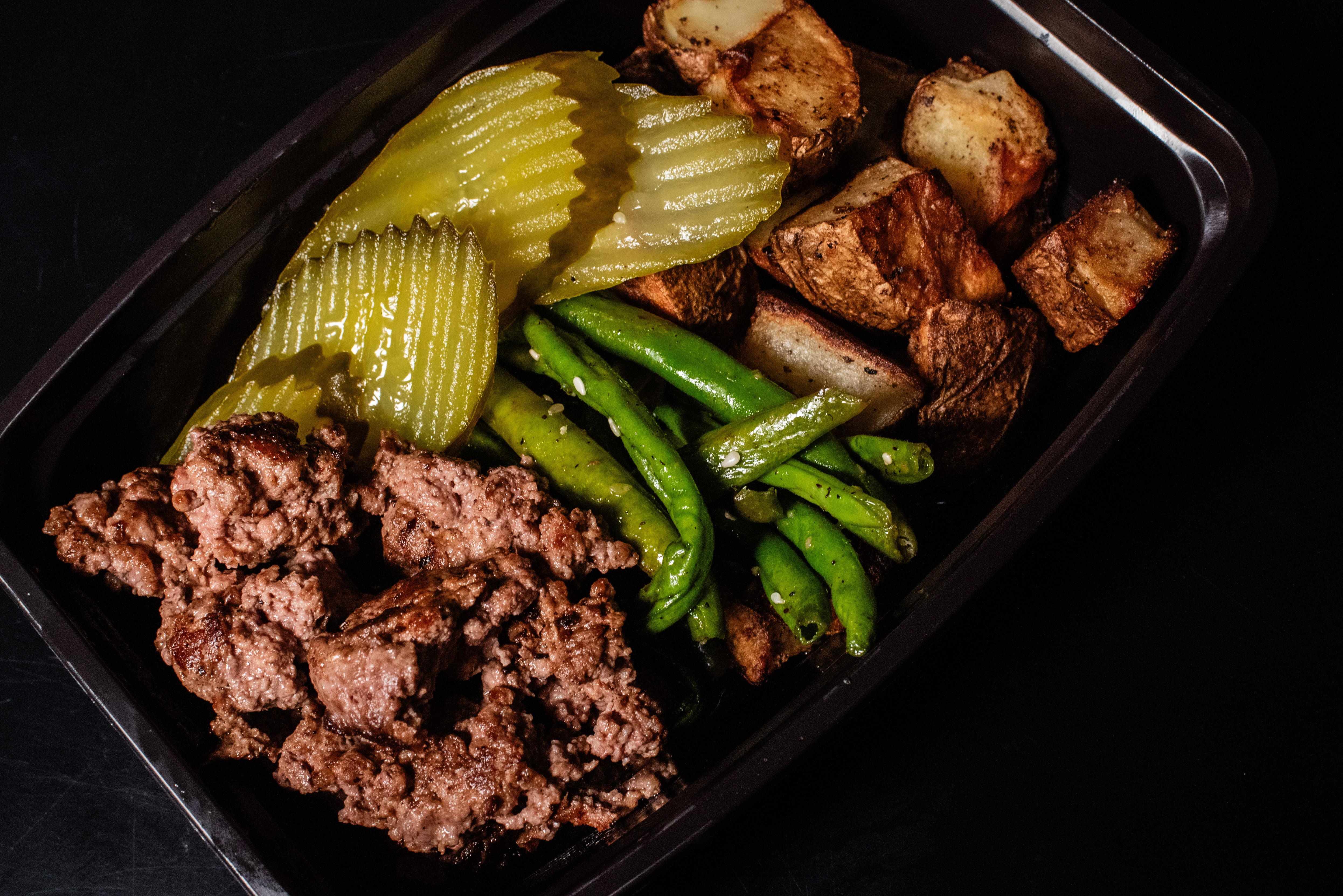 Lean Burger Bowl with Seasoned Diced Potatoes, Greens, Pickles, and Ketchup